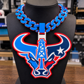 Texans Oilers hype chain with a bull-head silhouette, central oil derrick, and star in blue, red, and white on a black display bust.