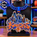 New York Knicks hype chain in orange and blue with Statue of Liberty, skyline, and basketball details on a black display bust.