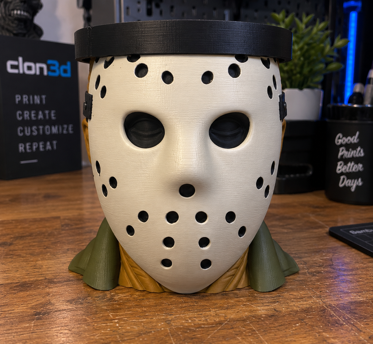 Jason Voorhees candle holder with an off-white hockey mask, green collar, and black circular top tray.