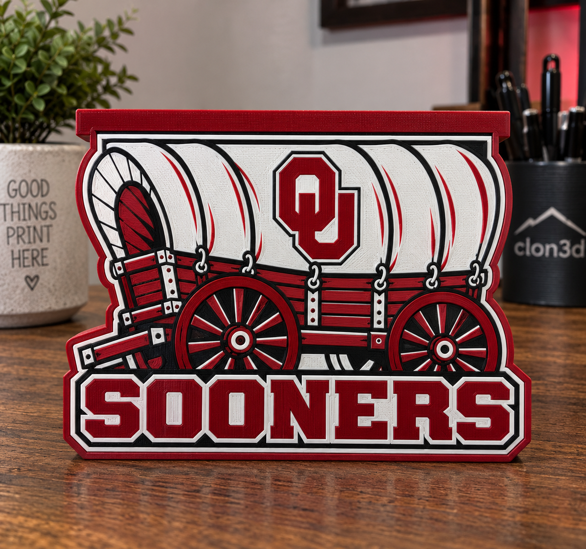 Oklahoma OU Sooners candle holder with crimson-and-white covered wagon, OU emblem, Sooners lettering, and raised top tray.