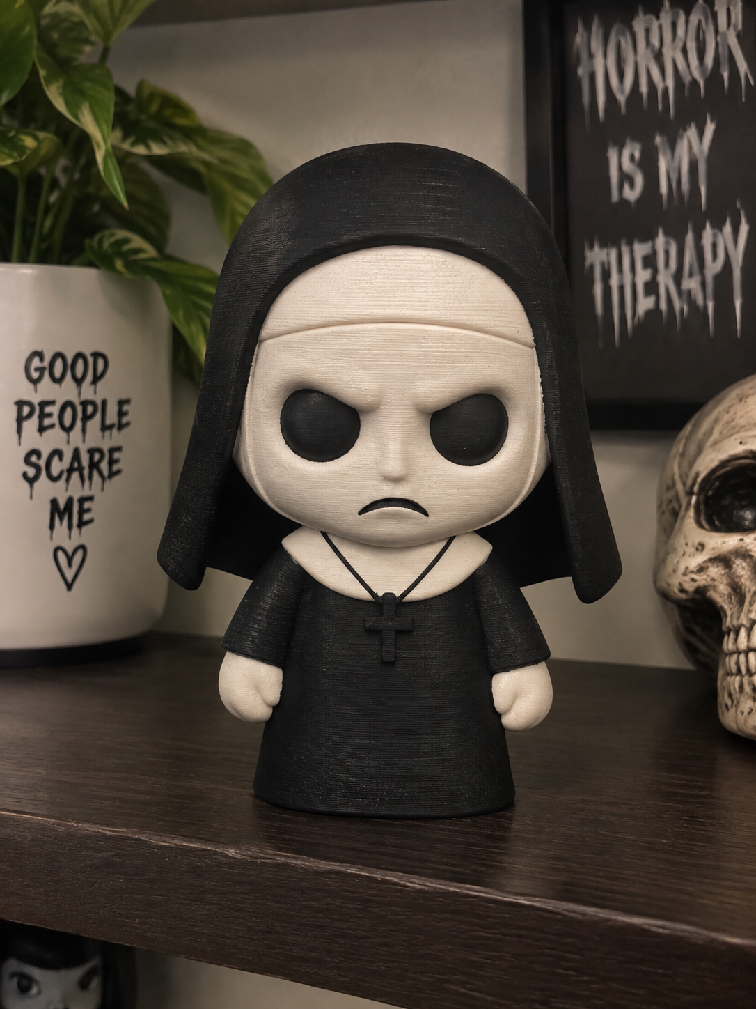 Black-and-white Nun micro statue with dark eyes and a cross necklace, shown as a preview for the digital download.