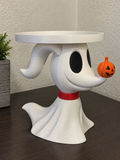 White Zero ghost-dog candle holder with red collar, orange pumpkin nose, and raised white circular tray.