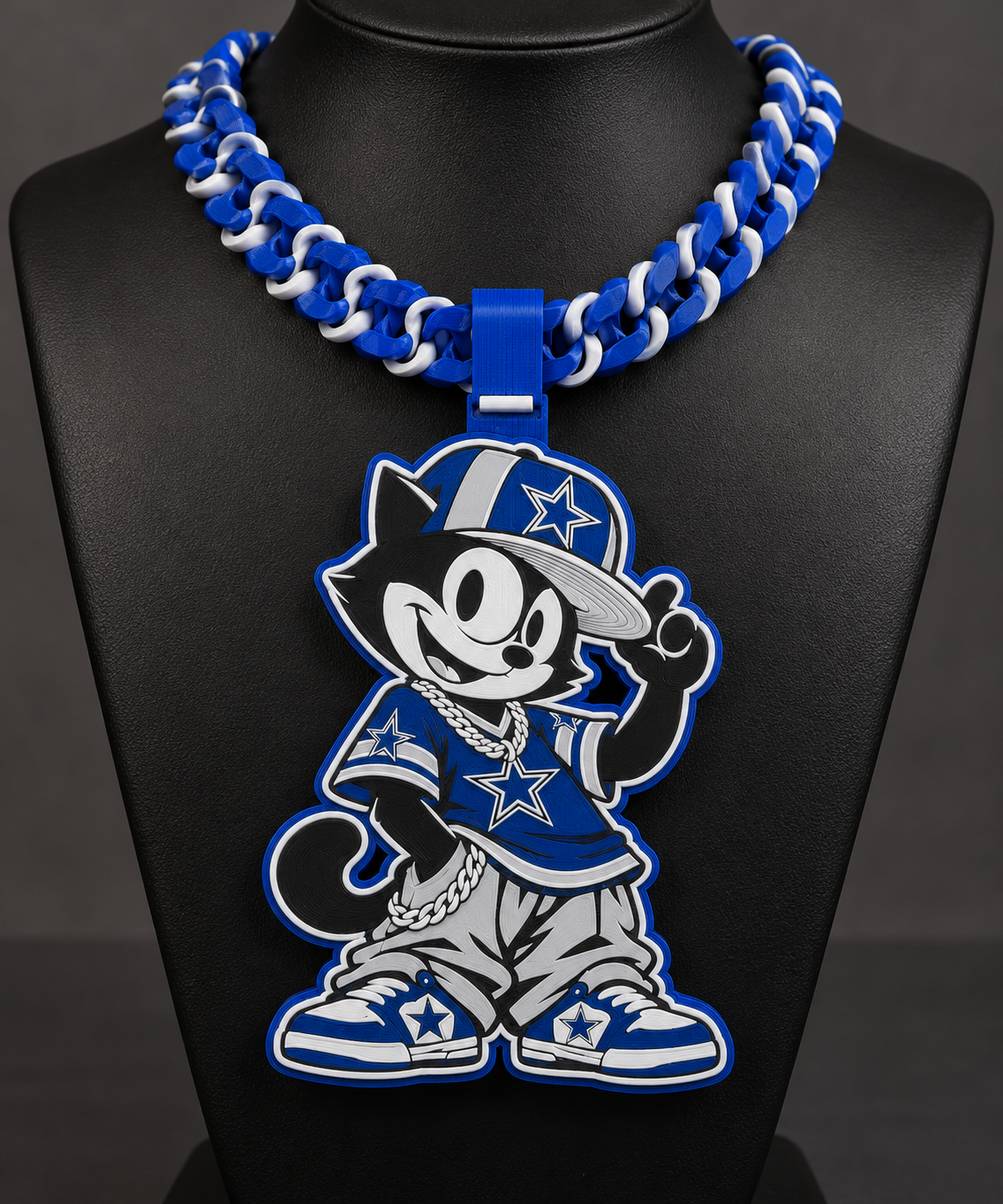 Felix the Cat Dallas Cowboys character pendant with blue-and-white chunky chain on a black display bust