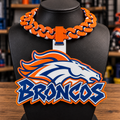 Orange, navy, and white Broncos hype chain with horse-head emblem and Broncos lettering on a black display bust.