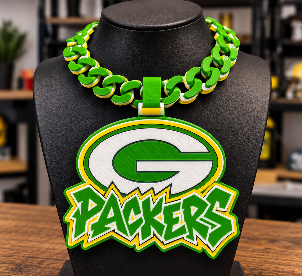 Green Bay Packers hype chain with a large G emblem and Packers lettering in green, yellow, and white on a black display bust.