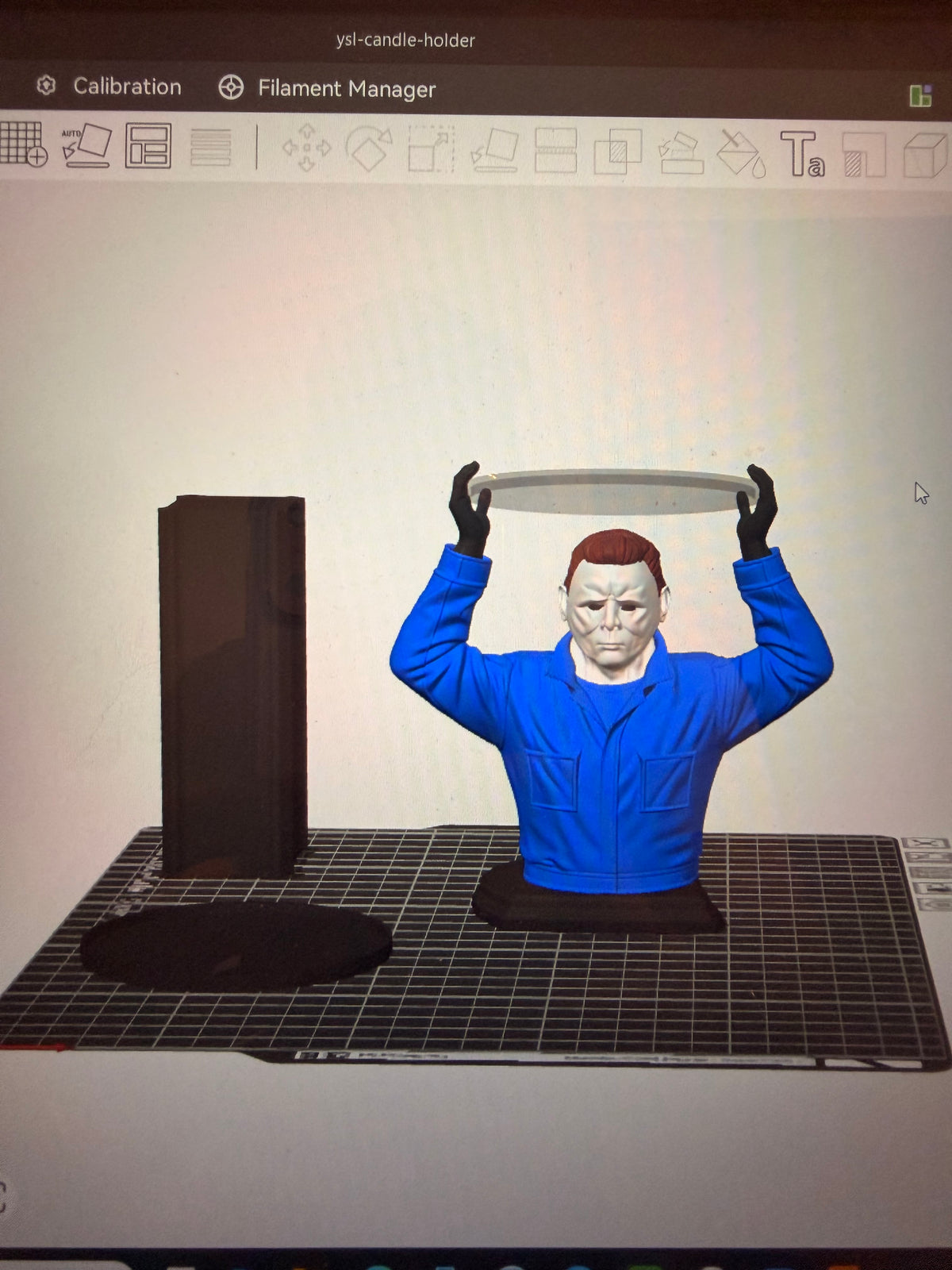 Digital model preview in slicing software of Michael Myers holding a circular tray overhead; not a finished-product photograph.