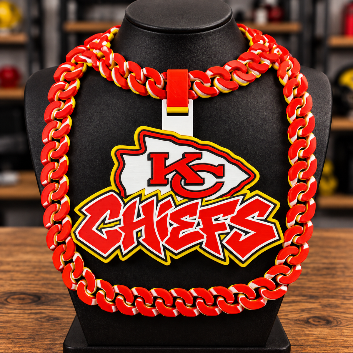Kansas City Chiefs hype chain with KC arrowhead emblem and red Chiefs lettering on a black display bust.