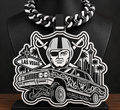 Black-and-white Raiders lowrider hype chain with Las Vegas landmarks on a black display bust.