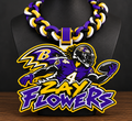 Zay Flowers hype chain with number 4 player, Ravens imagery, and purple and yellow lettering on a black display bust.