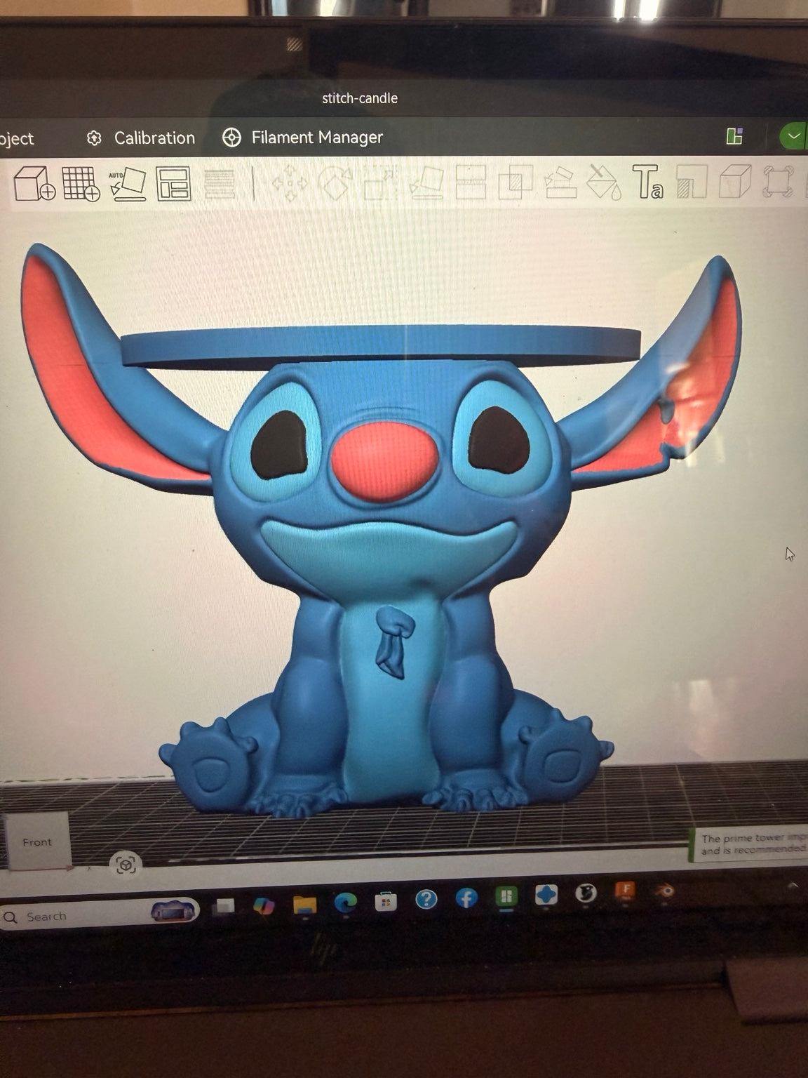 Digital model preview of a seated Stitch candle holder with oversized ears and a circular top tray, displayed in slicing software.
